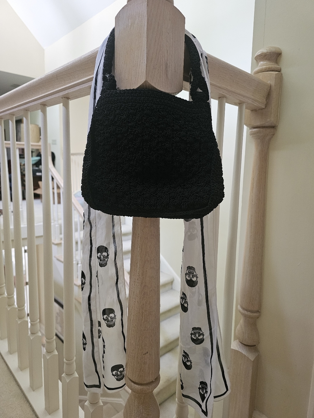 Chic Black Shoulder Bag with Printed Scarf Accent